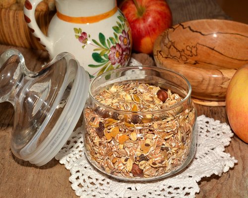 A simple breakfast with oatmeal and tea on a wooden table